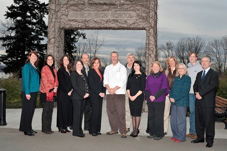 Heathman Hotel General Manager Les Utley (right) recently took the lead on adopting Heritage Park after city budget cuts eliminated garbage cans and portable restrooms in several neighborhood parks. Utley is pictured with his management team and city leaders at the park.