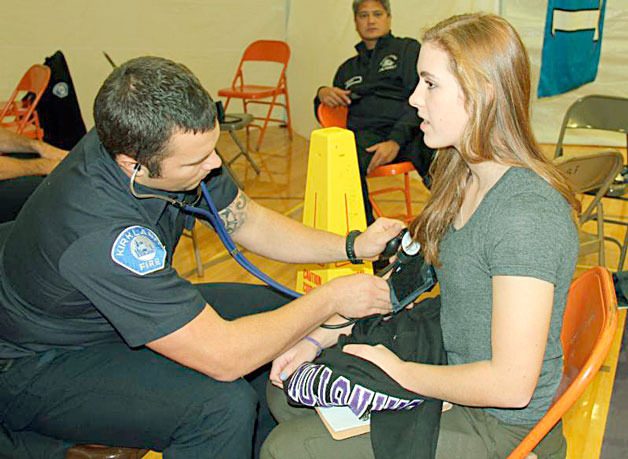 A student is screened by a member of the Kirkland Fire Department at the Nick of Time screening on Nov. 5.