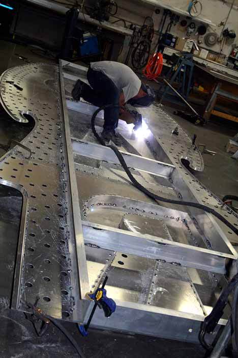 A welder for The Sign Factory works on the replacement for the old Paramount Theatre sign in downtown Seattle.