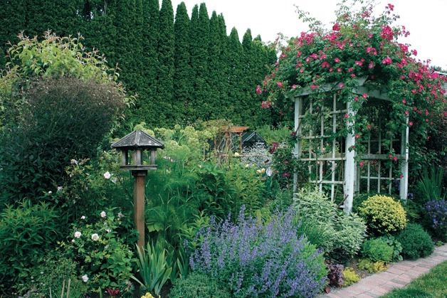 Susan Gillman and her husband created their garden from nothing after their house burned down in 1993. Their backyard (pictured) also includes a vegetable garden.