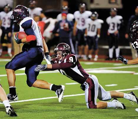 Juanita running back Cole Graves break a tackle at Islander stadium on his way to the end zone against Mercer Island.