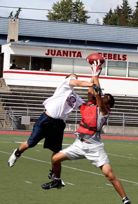 Juanita players play through a scrimmage during the first week of practices on Friday. Kirkland high schools began football preseason practice on Wednesday.