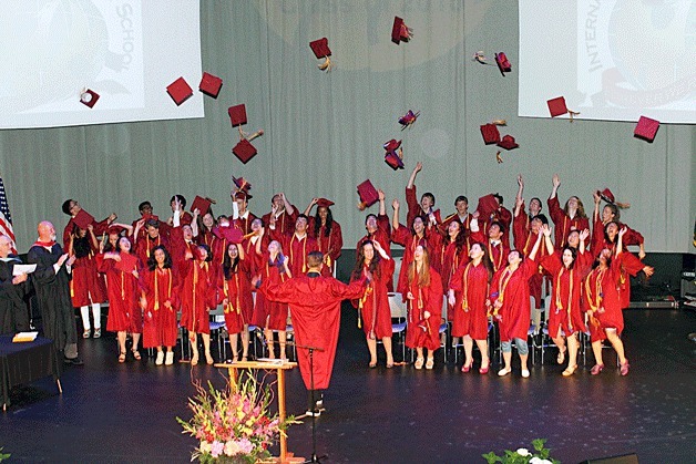 International Community School students celebrate their high school graduation.