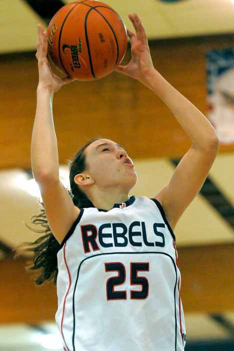 Rebel Molly Grager grabs a rebound against Mercer Island earlier this season.