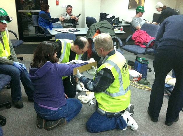 Participants in a recent Community Emergency Response Team (CERT) training program learn how to assess and take care of injuries. Registration is now open for the next program that begins on Sept. 17.