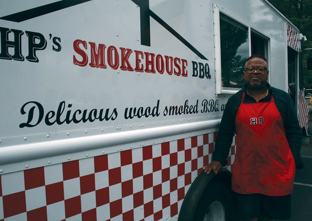 Owner Stanley Hamilton Payne II stands in front of HP’s Smokehouse BBQ. The food truck can be seen at the Juanita QFC parking lot from 12-7 p.m. on Thursdays