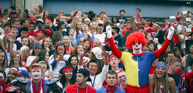 Juanita High School football fans cheer on the team during a home game against Lake Washington earlier this season.