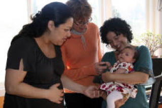 Birthing and postpartum doula Jan Martinka (center) chats with mom-to-be Levonne Padilla (left) and Sarah Levy