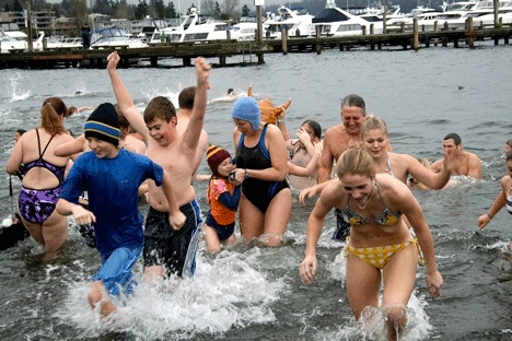 Hundreds plunge into Lake Washington's freezing water on New Year's Day at Marina Park.