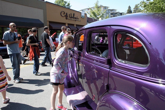 A girl checks out the interior of a class car during the annual Kirkland Classic Car Show on Park Lane last year. This year's 9th annual event will run from July 30-31 at Marina Park and downtown streets.