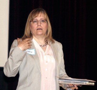 Businesswoman Louise Holder makes a point while speaking at the Greater Bothell Chamber of Commerce morning meeting last Thursday at the Northshore Senior Center. She owns Holder’s Ink in Kirkland.