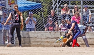 Juanita’s Taylor Paddock hits a single off North Central Kilee Brown Friday at the state softball tournament in Tacoma.