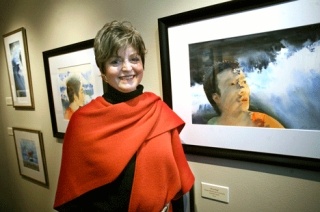 Artist Nicki Smith with her watercolor art