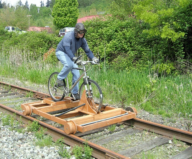 Kirkland resident John Eineigl invented what he calls a rail-bike that he rides along the old Burlington Northern Santa Fe Railway