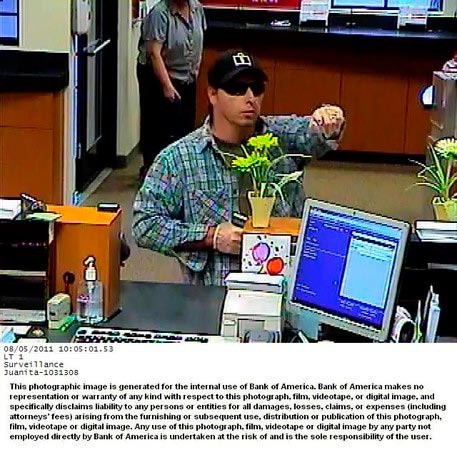 This video surveillance photo released by the FBI shows a man who robbed a Bank of America branch in Kirkland's Juanita Village Friday morning. The FBI considers the suspect armed and dangerous and is asking the public for help in identifying him.