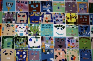 These glass designs were created by all 361 students at Juanita Elementary. The creations were made into 5-inch by 5 inch squares and fused together. The glass pieces were donated to the school by Spectrum Glass located in Woodinville.