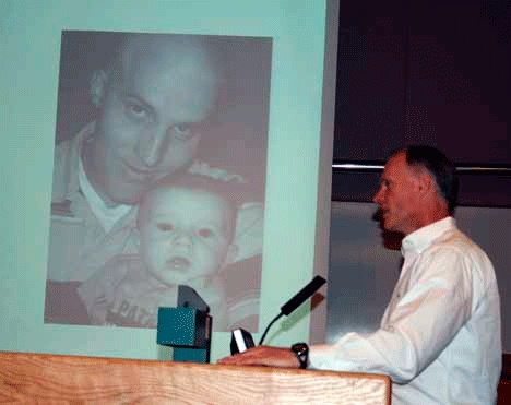 Sen. Rodney Tom (D-Bellevue) testifies in front of a picture of Kollin Neilson and his son to the Kirkland City Transportation Committee in June. This week