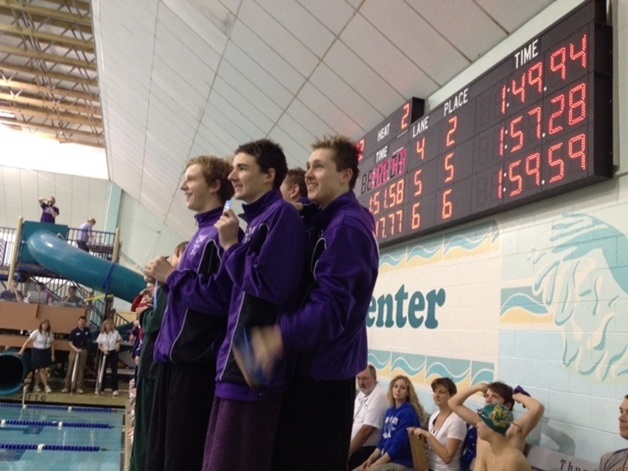 The Lake Washington High School boys 20-yard medley relay team stands atop the podium during Saturday's District Championship meet.