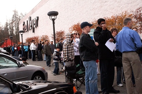 More than 600 people stand in a line that wraps around the Fred Meyer building as they wait for an H1N1 vaccine Wednesday. The Kirkland pharmacy had just 250 vaccines.
