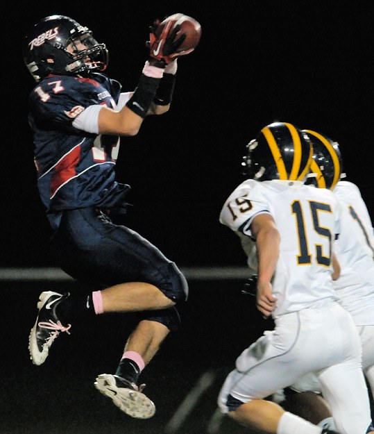 Rebel WR Austin Hilliker makes a leaping grab in the endzone for a touchdown against Bellevue on Friday.