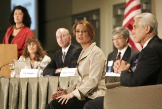 Darcy Burner answers a questioin as incumbent Rep. Dave Reichert (right) and other panelists look on during the U.S. House of Representatives 8th Congressional District Debate at Meydenbauer Center in Bellevue Oct. 8.