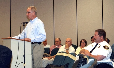 Kirkland Mayor James Lauinger addresses the Boundary Review Board while Woodinville District Fire Chief Bud Backer sits