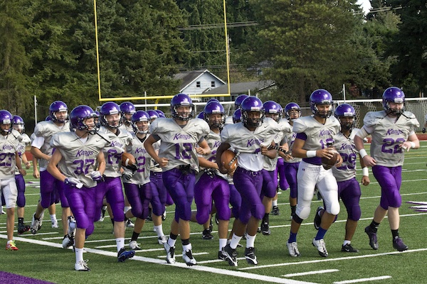 The Lake Washington High football team is all smiles as they take a light jog around the field before a recent practice. The Kangs opened up their 2012 season with a 56-20 win over Foss last Frlday.