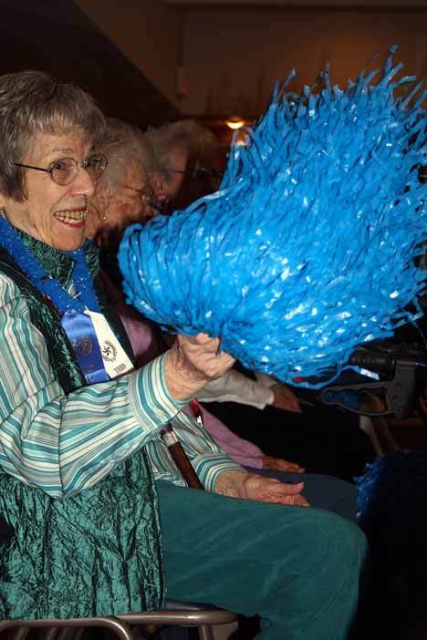 A senior at Madison House cheers on her team during the Senior Olympics' bean-bag toss.