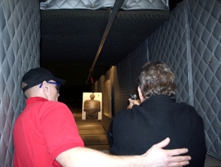 Kirkland City Councilman Bob Sternoff (right) gets a lesson on how to shoot a Sig Sauer .38 caliber pistol by Kirkland Police Cpl. Nathan Rich at the Issaquah City Hall firing range March 18.
