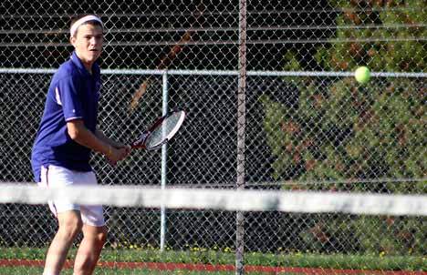 Lake Washington's Patrick McCarthy returns a volley during a doubles match against Inglemoor.