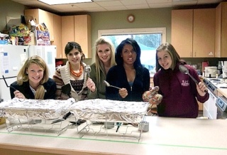 Girl Scouts from Troop 53114 get ready to serve up some food to Tent City 4 residents at Woodinville Unitarian Universalist Church recently. The homeless encampment has since moved on to St. Jude Catholic Church in Redmond. From left: Claire Wilson