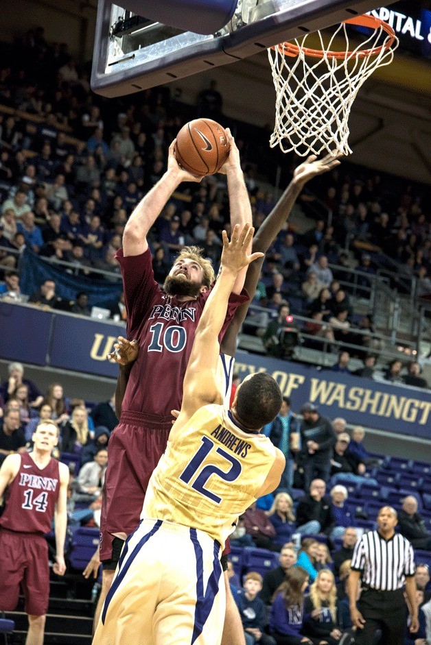 Lake Washington High School graduate Darien Nelson-Henry goes up for a shot against Andrew Andrews in Alaska Airlines Arena at Hec Edmundson Pavilion on the University of Washington campus. Nelson-Henry led the Pennsylvania University men’s basketball team against the Huskies on Saturday by scoring 13 points and pulling down six rebounds. UW won the game