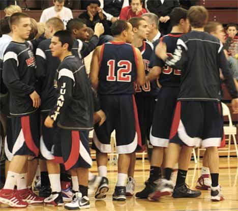 The Juanita boys basketball team prepares for their game at Mercer Island Tuesday.