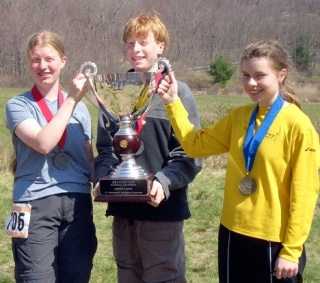 Members of the orienteering team from the Environmental & Adventure School (EAS) in Juanita are all smiles after winning the first-place trophy for middle schools at the national orienteering championship meet at West Point