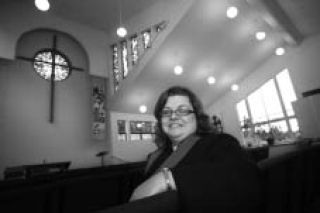 Reverend Kerry Grogan sits in the sanctuary at Lake Washington Christian Church.