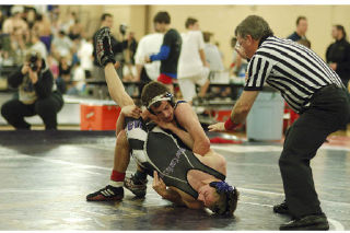 Senior Jake Brown wrestles at the Lake Washington Tournament on Dec. 13. Brown made it to the finals for the 125-pound weight class.