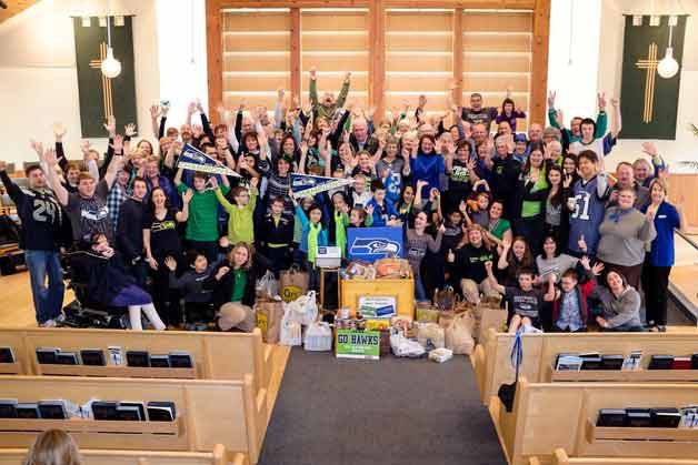 More than 70 Seahawk fans at Lake Washington United Methodist church in Kirkland collected $125 and more than 650 food items for local Pantry Packs that will get sent home with school children to beat weekend hunger during the 'Week One' returns in the Super Bowl Food Drive.