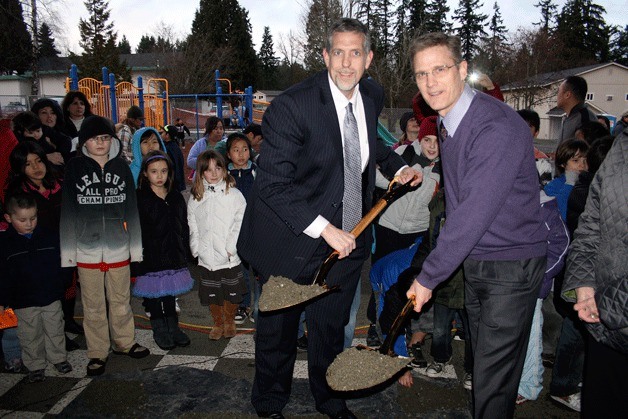 John Muir Elementary principal Jeff DeGallier (right) and Lake Washington School District Superintendent Dr. Chip Kimball hold the ceremonial shovels for the groundbreaking of the new school during an event Thursday.