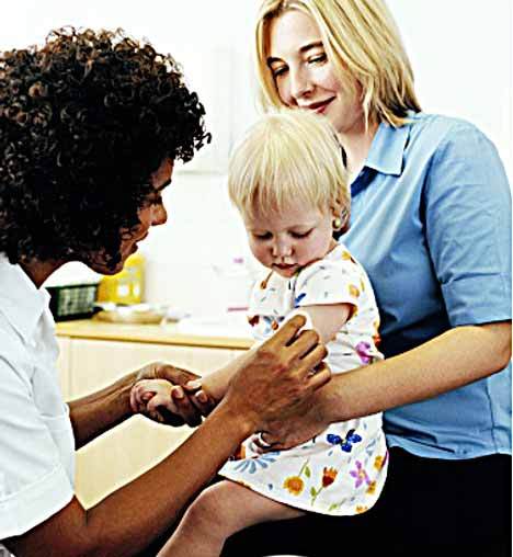 A little girl receives her flu shot.