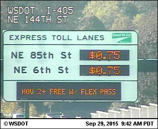 The first day of tolls on I-405 yielded fast commutes for those who paid and a very slow commute for those who did not.