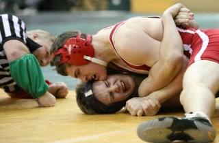 Juanita's Matt Skurnik (in red) wrestles Lake Washington's Collin Story during a match at Redmond High School on Jan. 29.