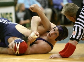 Lake Washington's Grant Haschak (right) wrestles Juanita's Stefan Kiehn during a match at Redmond High School on Jan. 29.