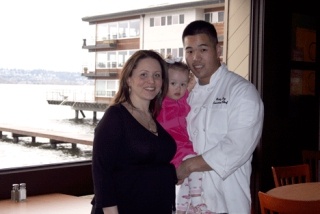 BeachHouse Bar & Grill owners Maria and Ricky Eng show off their restaurant's Lake Washington view April 1. Also pictured is their daughter