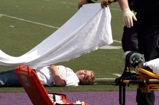 A mock DUI crash scene shows Lake Washington High School student Tori Jacobson as the victim of a deadly head-on car accident as the result of a drunk driver Friday at the school's football stadium. The reenactment