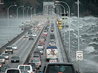 50 mile per hour wind and waves from the south batter the 520 floating bridge as afternoon commuters travel eastbound.
