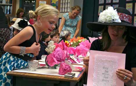 Ava Jaksha and her mother Sherri share a Mothers’ Day moment during the Jensen’s Jungle Mothers’ Day Tea Party at Lakeview Elementary on Friday.