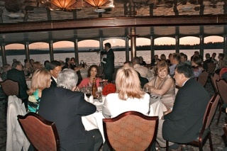 About 125 guests mingle during the live auction portion of the Royal Argosy dinner cruise that helped raise money for the Greater Kirkland Chamber of Commerce on May 8. During the Annual Gala & Auction