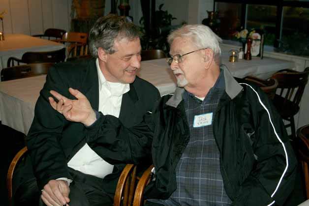 Kirkland resident Dick Ekins chats with Greater Kirkland Chamber of Commerce Executive Director Bill Vadino during a farewell event in Vadino's honor at the Crab Cracker on Thursday night. The community gathered to say goodbye to Vadino