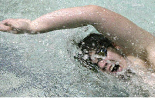 Junior Alex Helsel swims during a team practice at Juanita High School on Tues.