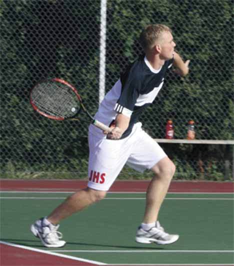 Juanita’s  Garrett Lee returns a volley during a doubles match with teammate Danny Zens. The team lost to Mercer Island’s  Andrew Smith and Jared Thomas 6-2